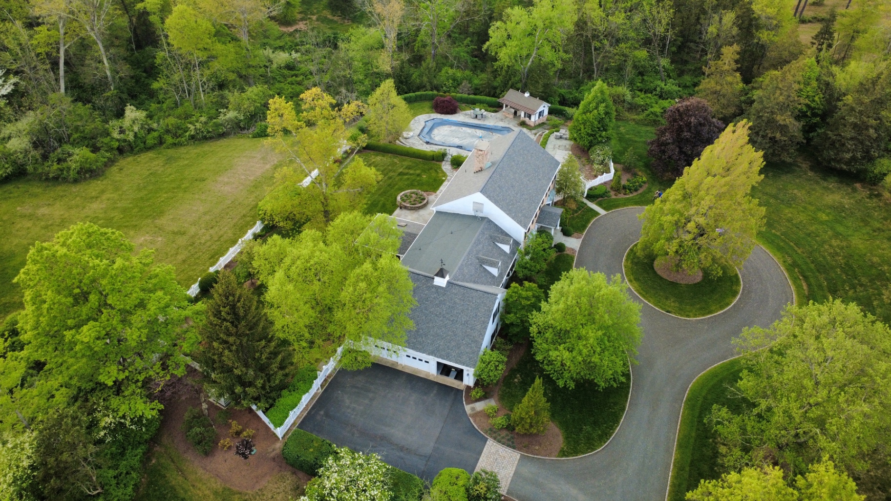 Aerial view of a completed gray shingle roof
